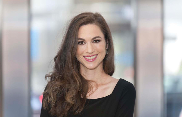 woman with long brown hair smiling