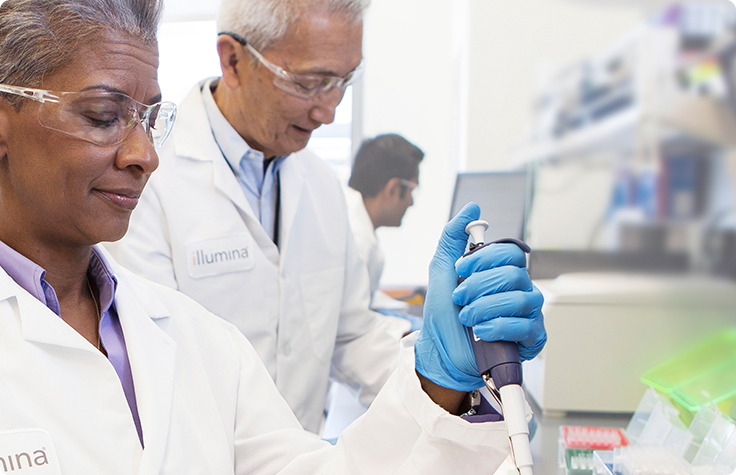 scientists in lab with pipettes