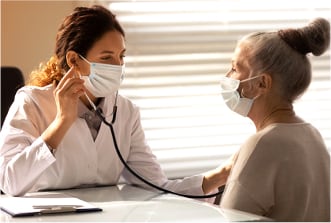 Doctor checking a patients lungs for signs of TB