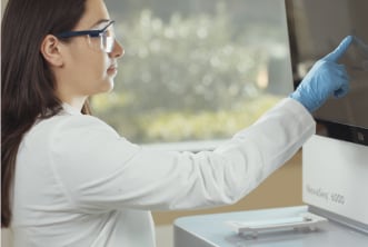 Scientist reviewing wastewater sample results from sequencer.