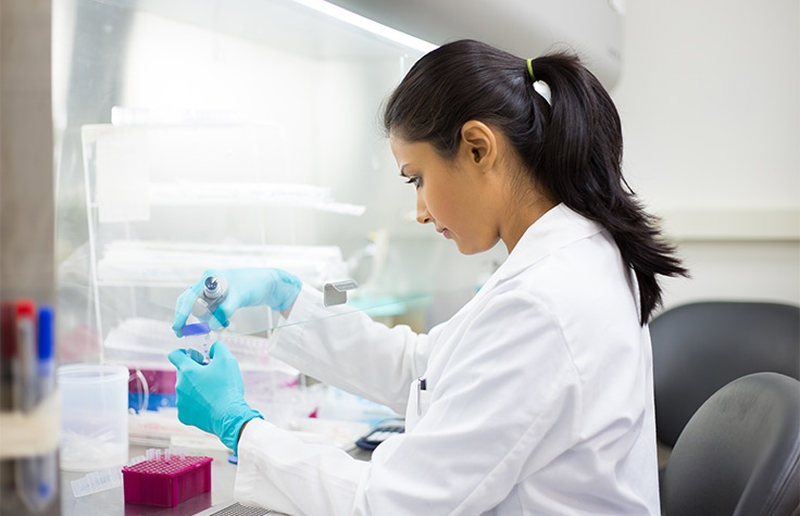 Scientist pipetting in lab